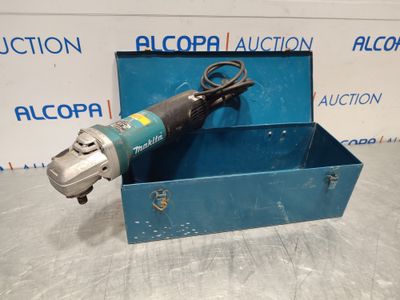 a blue box with an electric tool in it on a table