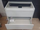 two drawers that are open on a wooden floor