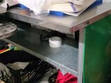 a desk with a computer on it in a messy room