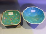 two bowls sitting next to each other on a table