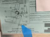 a piece of paper taped to the side of a machine