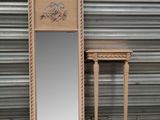 a mirror that is next to a table with a mirror on it