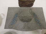 a picture of a metal object with beads on it