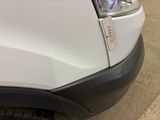 a close up of a white truck with a sticker on it ' s bumper