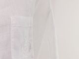 the shirt is white and has a pocket on the chest