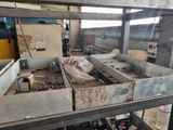 a picture of a machine that is working on a piece of metal