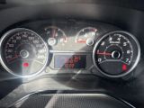 a close up of a car dashboard with a speedometer and gauges