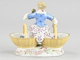 a figurine of a woman sitting in a boat