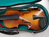 a violin in a case with a bow in it