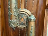 a clock that is hanging on the side of a wooden wall