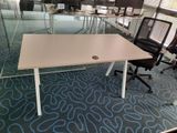 tables and chairs in an office with glass walls and blue carpet