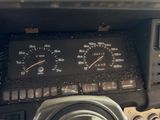 a close up of a car dashboard with a speedometer