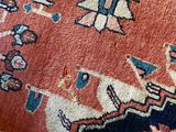 an image of a close up of a rug with a cat laying on it