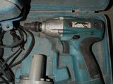 a blue box with a drill and a hammer inside of it