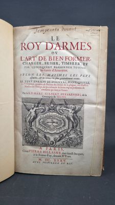 an open book with a picture of a coat of arms on it