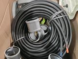 a cardboard box filled with different types of pipes and hoses