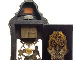 a clock that is sitting inside of a wooden case