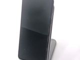 a cell phone that is sitting on top of a stand