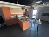 an image of a kitchen with a table and chairs