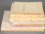 four books stacked on top of each other on a table