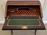 a small desk with a chess board on it