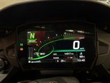 the dashboard of a motorcycle with a digital display on it ' s screen