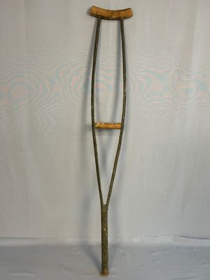 an old crutt with a wooden handle on it