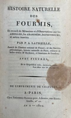 an old book with a piece of paper on top of it