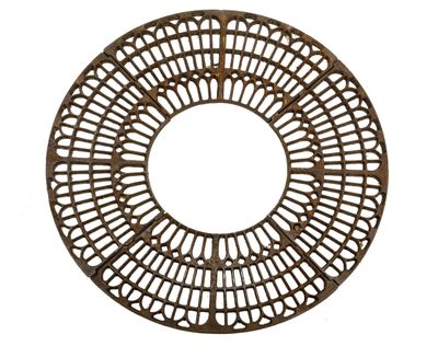 an image of a circular iron plate with holes in it