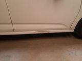 a white car that is parked in a garage