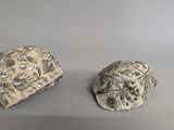 two rocks that are sitting next to each other on a table