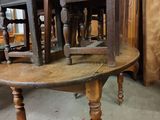 a wooden table with a wooden chair on top of it