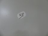 a picture of a white toilet with a sticker on it