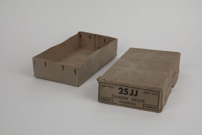 two empty boxes sitting side by side on a white surface