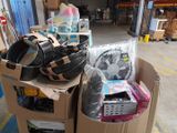 a pile of shoes and other items in a cardboard box