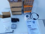 two boxes of electronic equipment sitting on a table