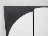 a black and white picture of a clock on the wall