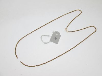 gros plan d'un collier auquel est attachée une étiquette