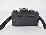 a black camera with a strap attached to it