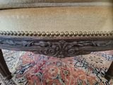 a close up of a chair on a rug on the floor