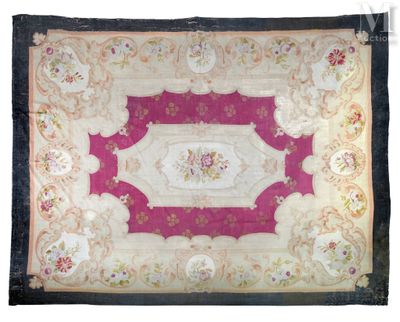 a pink and white rug with a floral design on it