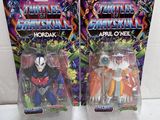 two action figures of the same character are shown on a white surface