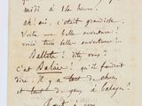 a handwritten letter written in black ink on a piece of paper