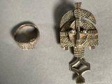 a silver ring and a silver ring sitting next to each other