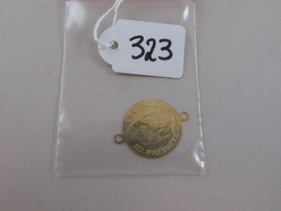 a gold coin in a clear bag with a price tag