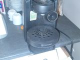a coffee maker sitting on top of a kitchen counter