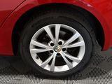 a red car that is parked in a garage