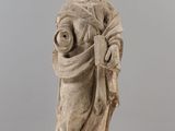 an old statue of a woman holding a baby in her arms