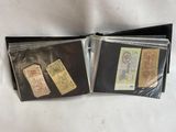three different types of money are in a wallet on a white surface