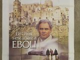 french movie poster of a man and a woman standing in front of a castle